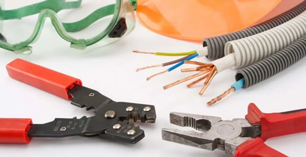 Electrical wiring repair with professional tools and safety equipment in West Newton, MA