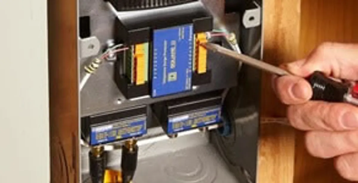 Whole home surge protection device being installed by a licensed electrician to protect electrical systems in Waltham, MA